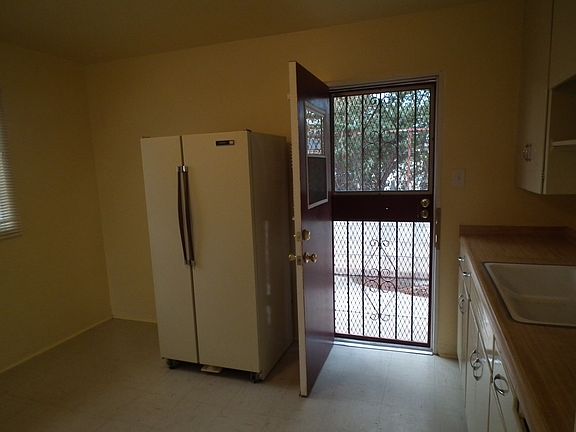 Security iron on the back door, fenced yard in back.