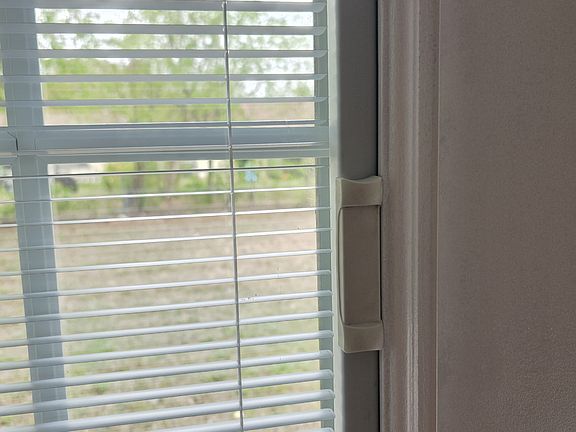Blinds inside double paned French door glass. Cannot get dusty or bent.