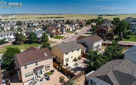 More rear aerial view of home to the north