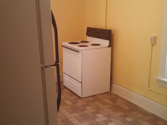 Large kitchen with new flooring.