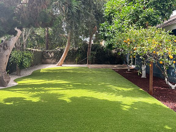 Backyard
Newly re-landscaped with premium synthetic turf. No watering needed, no water costs.