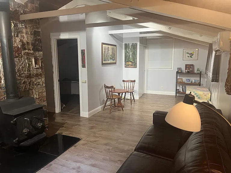 View from living room to back of cottage and bedroom entrance