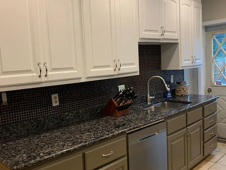 Kitchen with granite and stainless appliances
