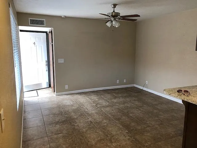 Light and bright living room, tile floors throughout