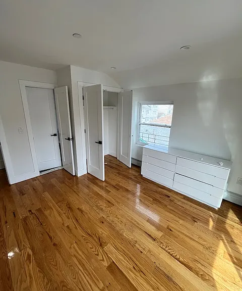 PRIMARY BEDROOM WITH PRIVATE DOOR TO THE BATHROOM