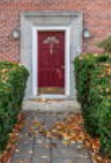 Front exterior entrance with landscaped walkway.
