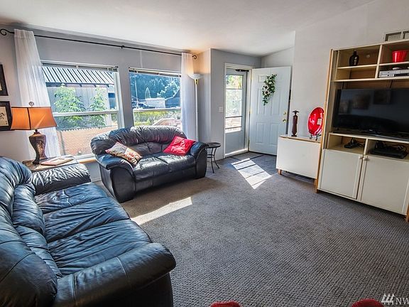 Tons of natural light flows into this lovely living room area.