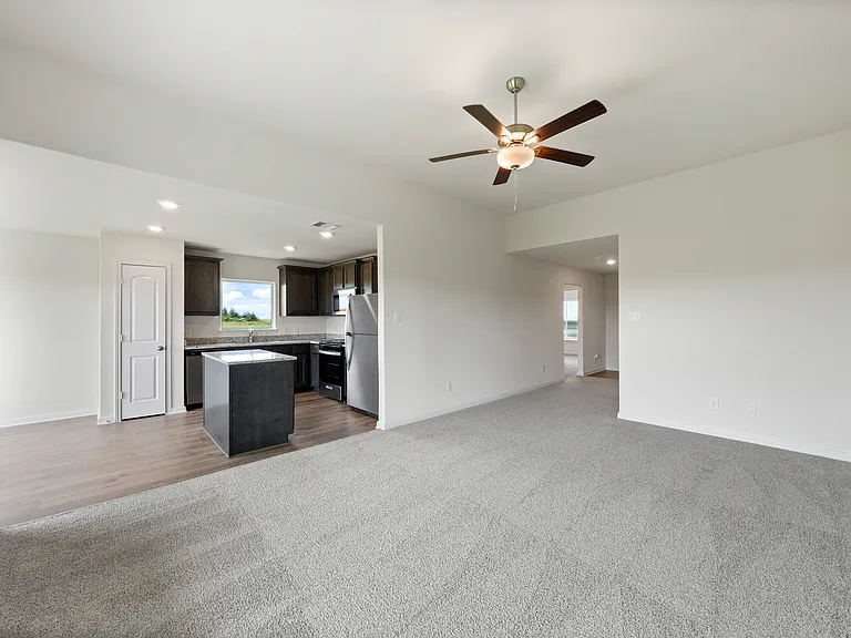 The open layout connects the family room with the kitchen and dining room.