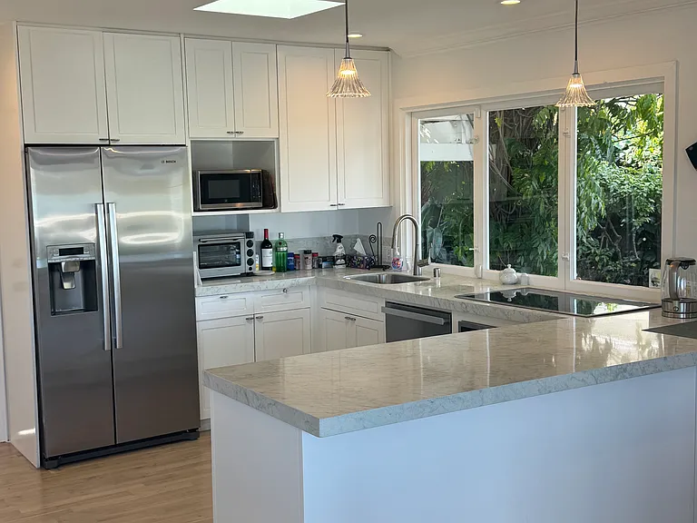 Large kitchen with garden view and Bosch refrigerator