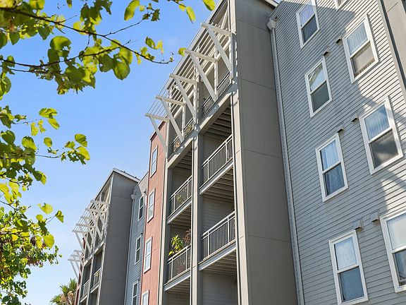 Contemporary facade with private balconies and charming architectural details.