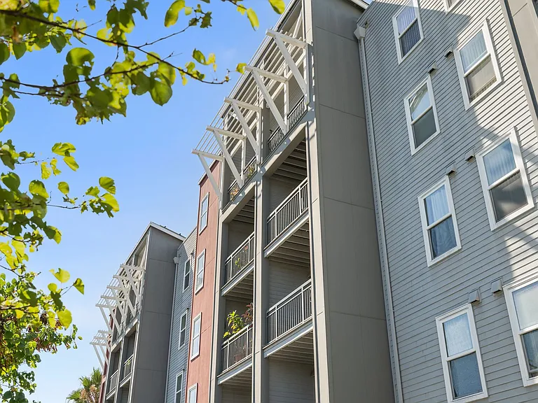 Contemporary facade with private balconies and charming architectural details.