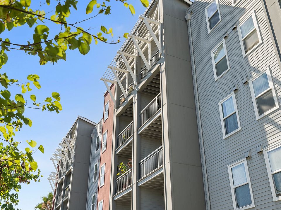 Contemporary facade with private balconies and charming architectural details.