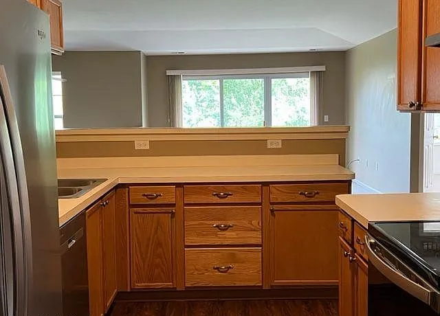 spacious kitchen with ample cabinets for storage