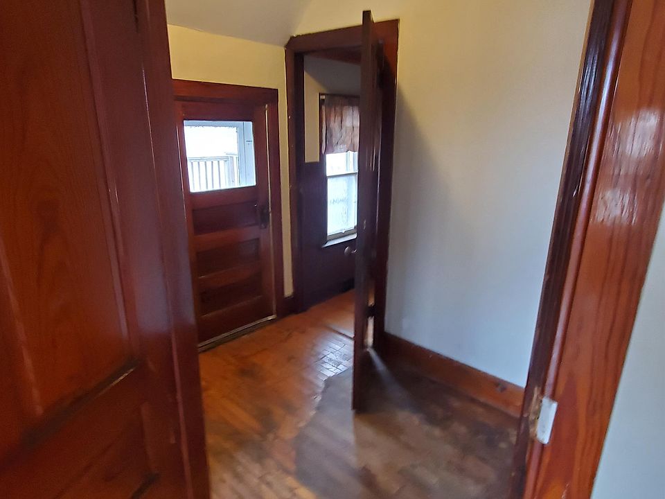 Hallway to bathroom at top of steps