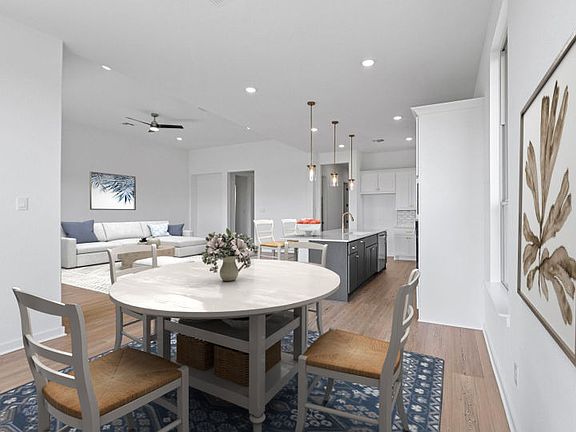 Modern kitchen in the Boling floorplan with spacious island and seamless flow to the gathering room.