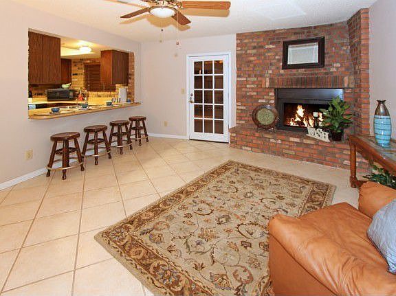 The large yet cozy Family Room has a fireplace and breakfast bar seating!