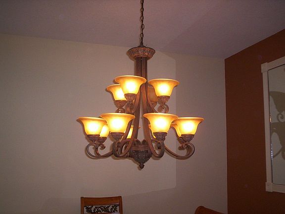 Dining room fixture with matching sconces and entry light