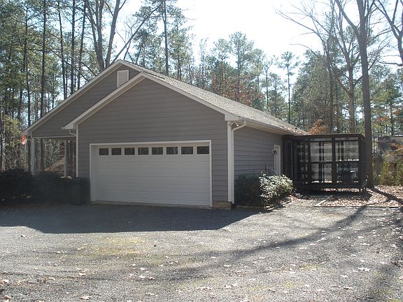 Side-entry garage is oversized, fitting two cars easily with