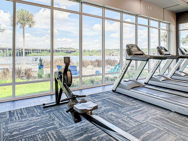 Feel energized by the rhythmic flow of water while you burn calories, making exercise an immersive, refreshing experience with the enchanting views at our riverside gym.