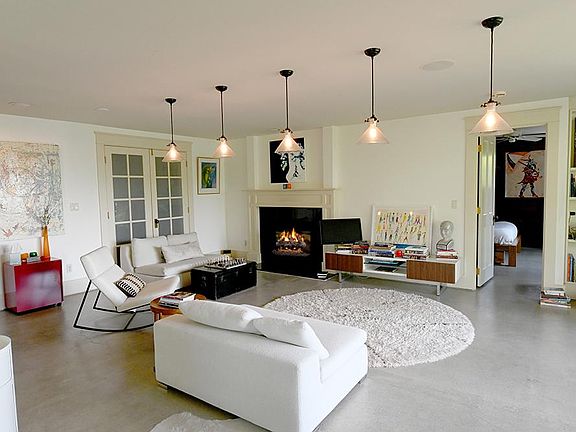 Living room with gas log fireplace with remote control.