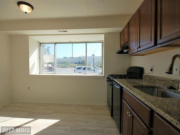 Spacious eat-in kitchen with new tile and lighting