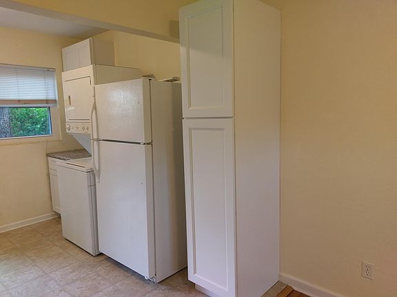 Kitchen pantry, refrigerator, washer, dryer.