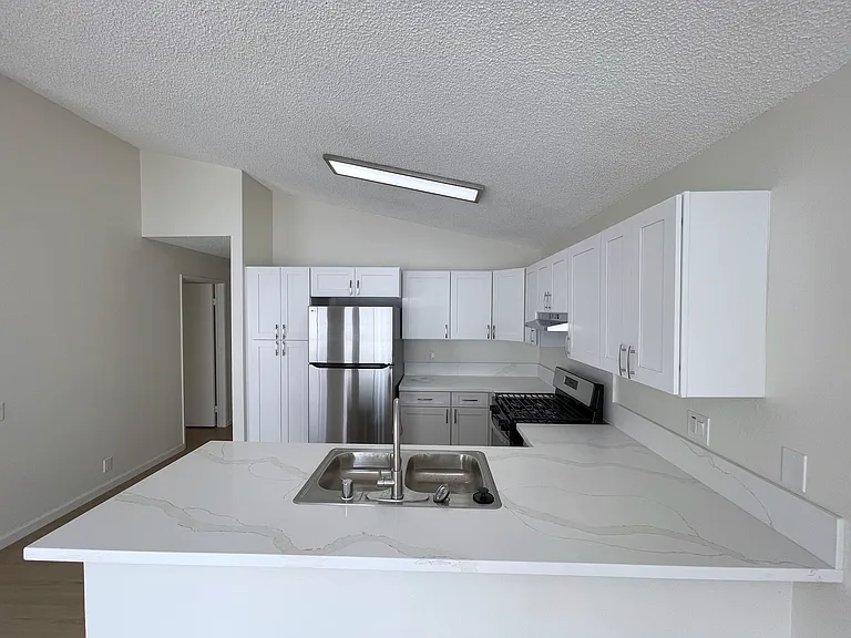 Newly renovated kitchen with brand new appliances, cabinets and countertops.