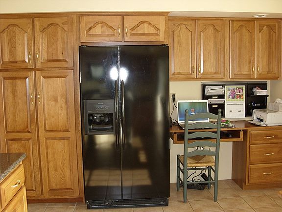 Large pantry closet and built in desk for convenience in the kitchen
