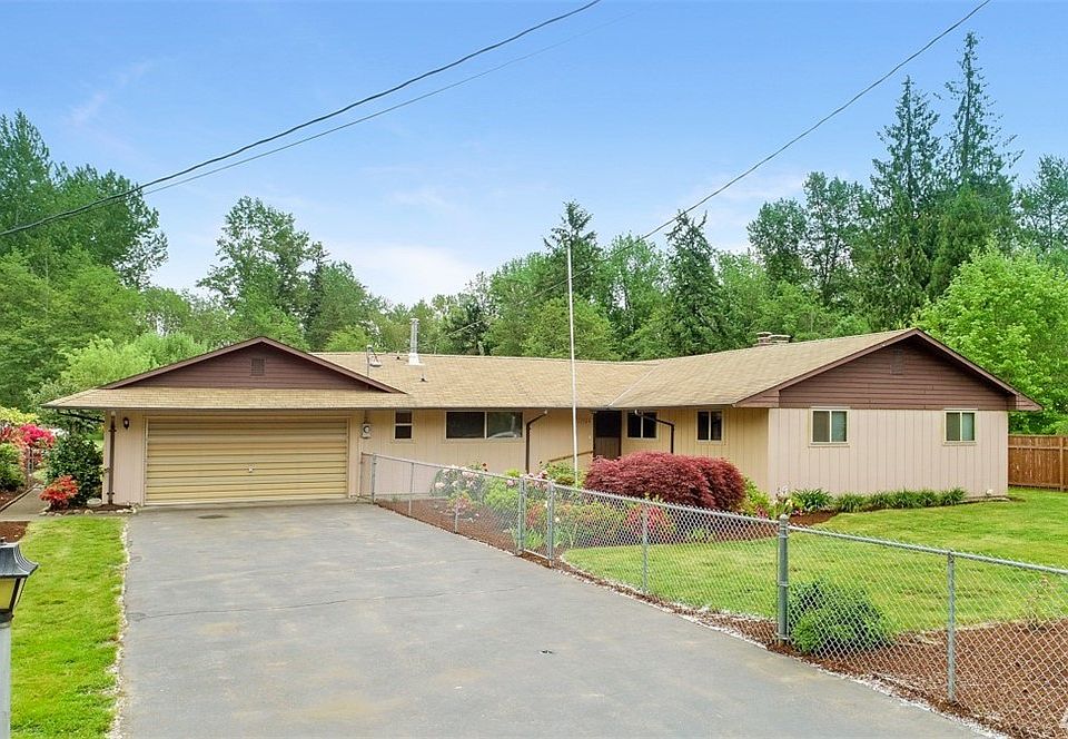 Enjoy plenty of parking on the level, paved driveway of this fantastic rambler with lovely landscapes. Photo reflects new roof that's scheduled to be installed mid-July. May still be time to choose your color!