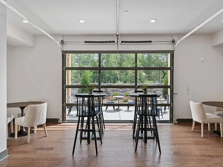 Resident lounge with retractable garage door