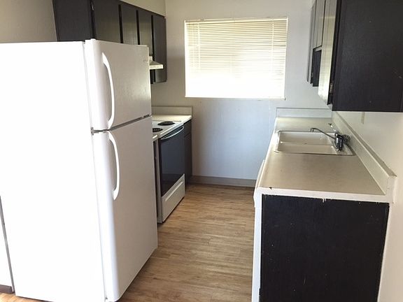 Kitchen includes dishwasher, electric range