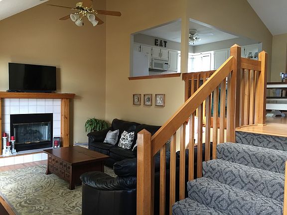 hardwood floors, designer carpet on stairs, gas fireplace