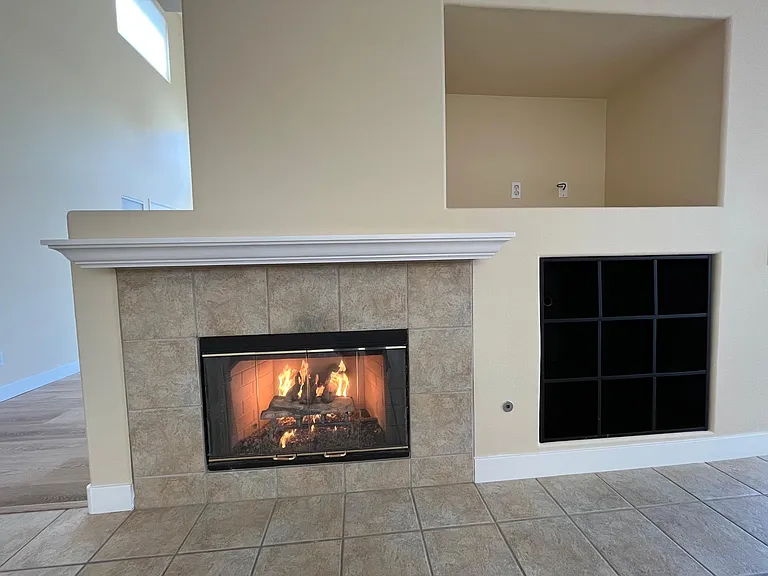 Large TV alcove and fireplace