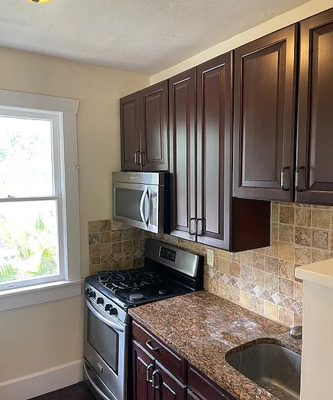 Kitchen has Granite and solid wood cabinets