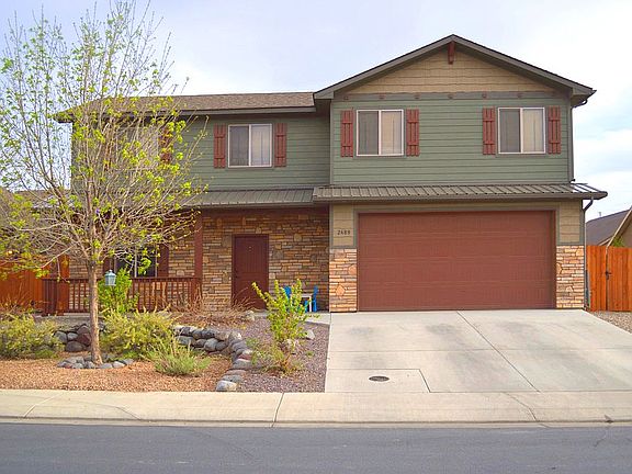 Xeriscaped front, lawn back