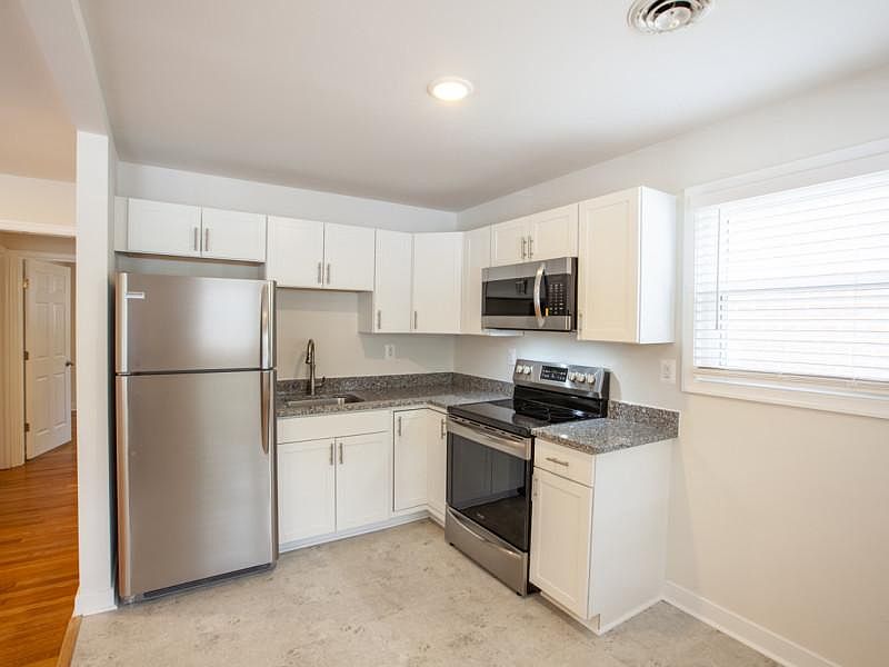 New stainless steel appliances and granite counter tops
