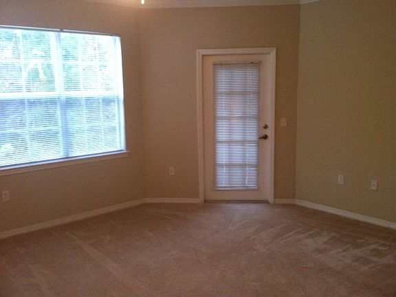 Living room w/ door to deck