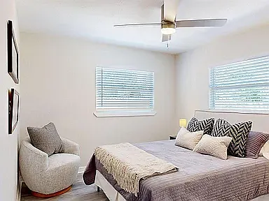 Furnished private room with queen bed, sitting area