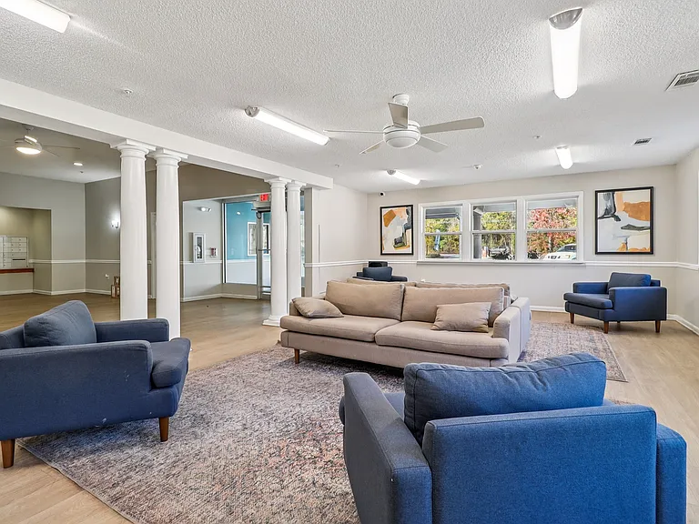 Relax in our spacious lounge offering comfortable seating and inviting decor for residents, professionally operated by Highlands Vista Group.