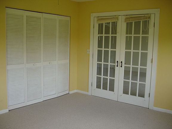 Elegant French Doors on 3rd Bedroom can be used as bedroom, office or den.