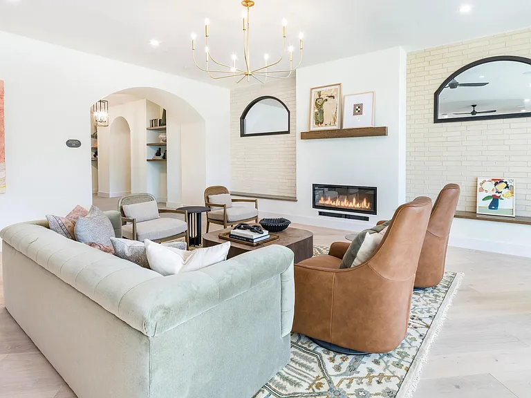 Brighlty lit resident lounge with ample social seating.