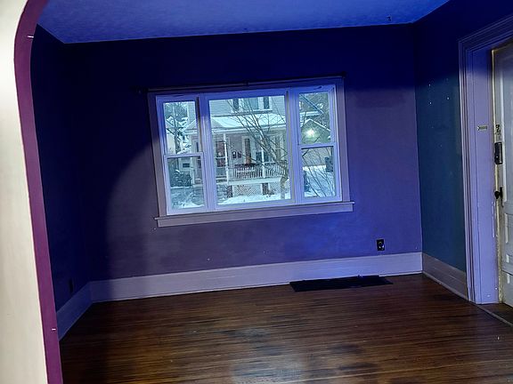 The living room is in front with three windows facing the street. (it was evening, sorry for the dark photo!)