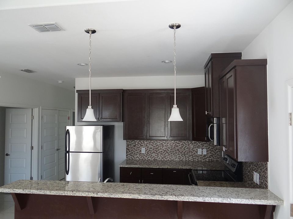 Spacious Kitchen with Granite Counter Top