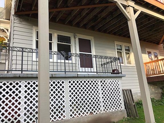 View of unit porch and entrance from back yard