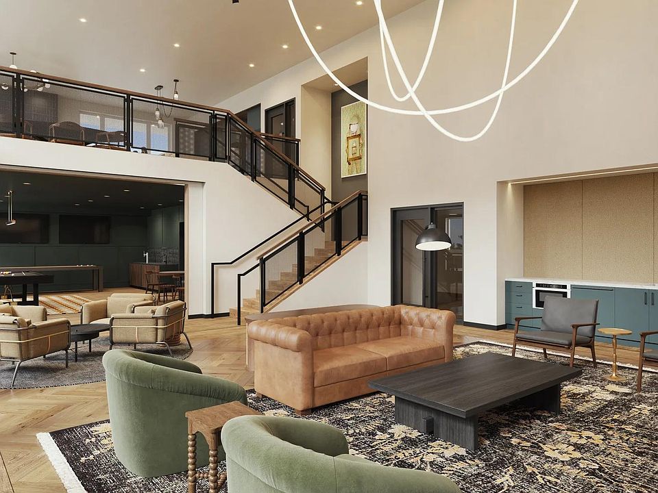 Two-story rooftop lounge with gathering space and demonstration kitchen at Modera Shoreline apartments near Seattle, WA.