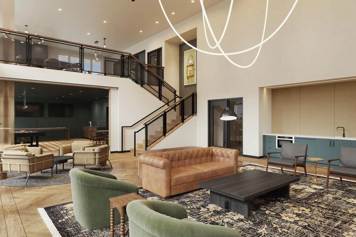 Two-story rooftop lounge with gathering space and demonstration kitchen at Modera Shoreline apartments near Seattle, WA.
