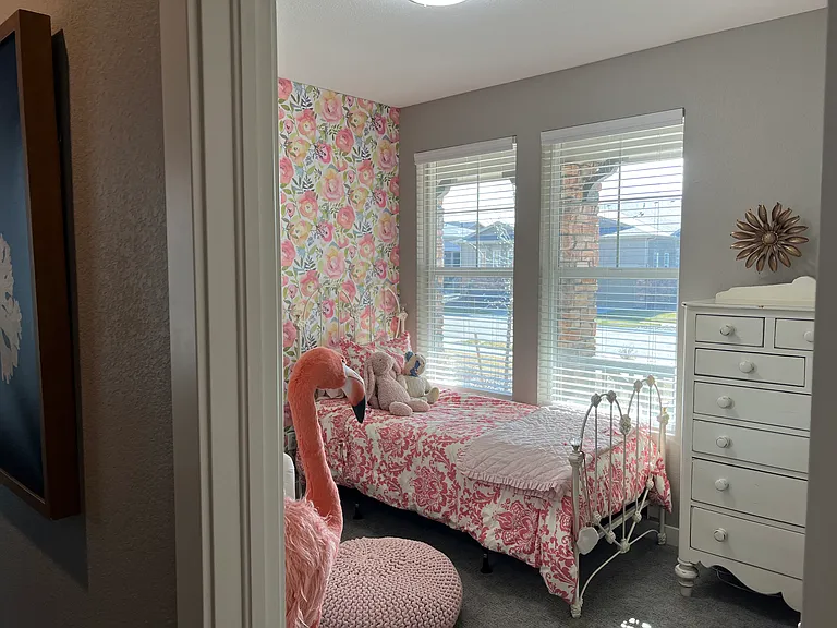 Upstairs bedroom #2 (there is no wallpaper on the wall now) or could be a main level home office