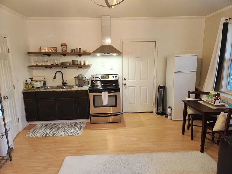 Gallery kitchen, door leading to office/ entrance with washer dryer.