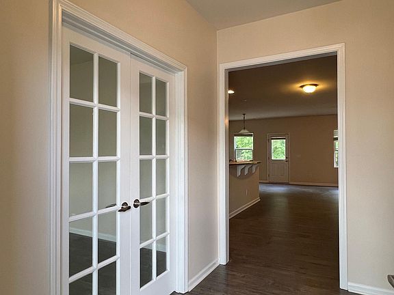 Foyer and office/study room with doors