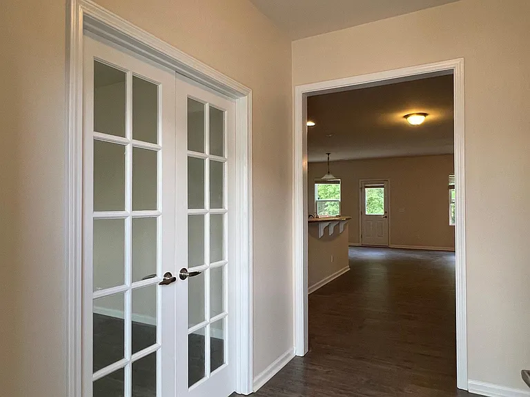 Foyer and office/study room with doors